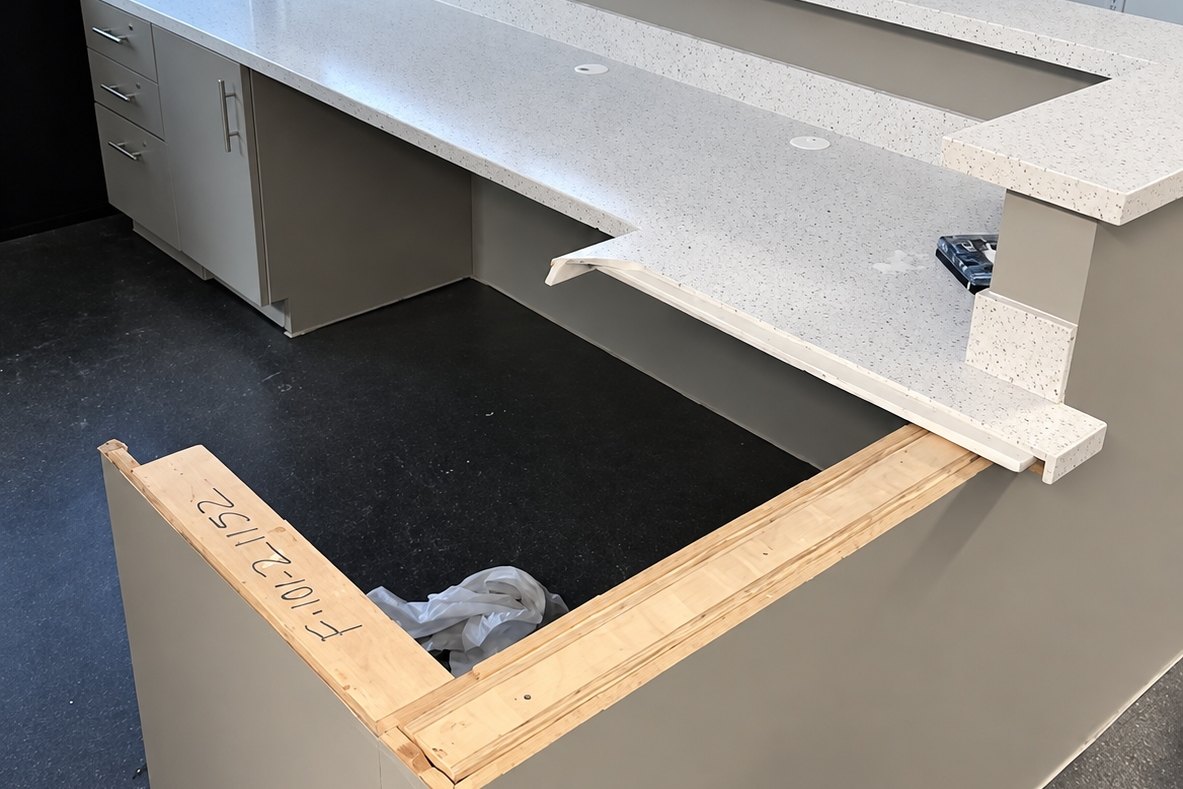 Reception desk with quartz counters under construction in an office