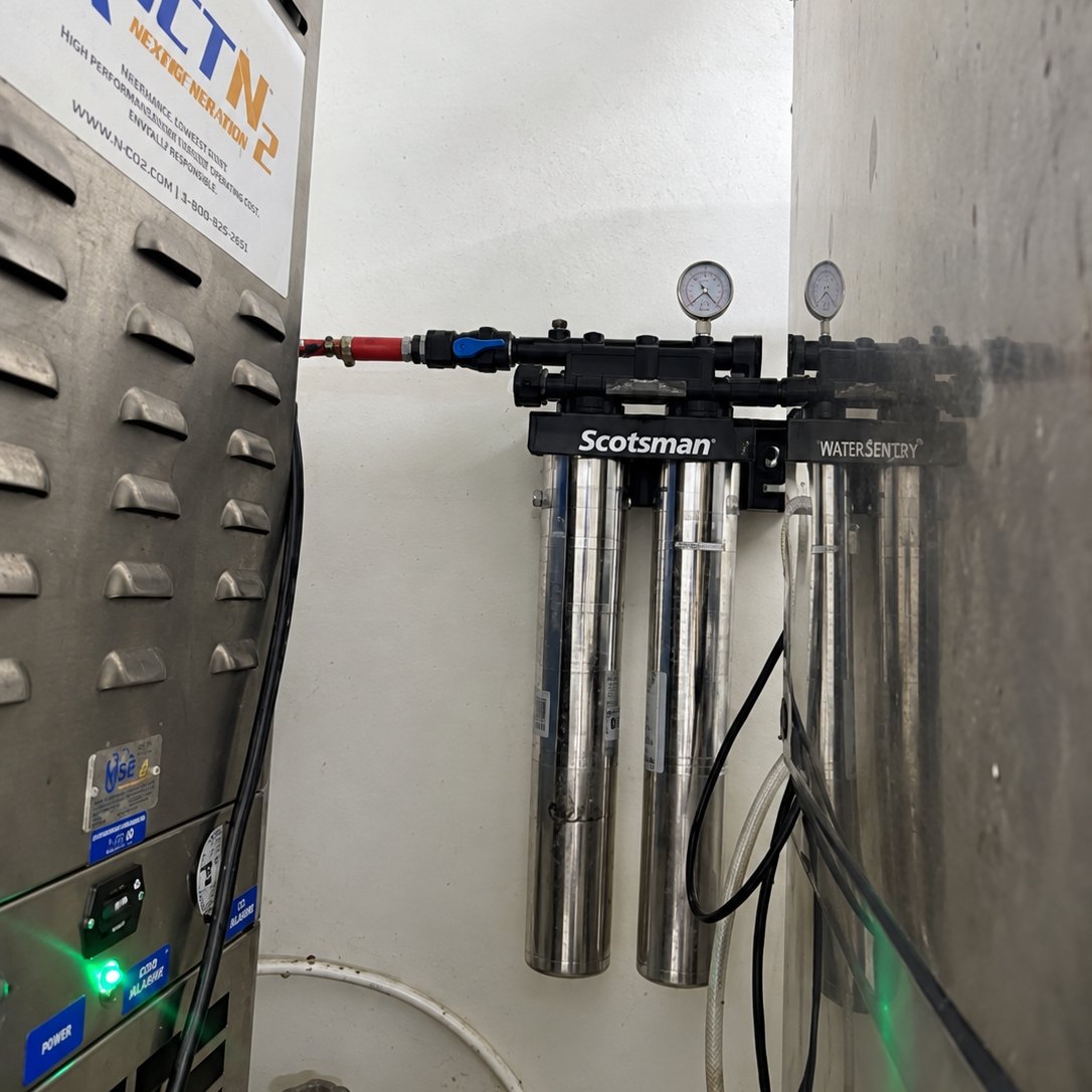 Stainless water filter cartridges on a manifold fed from a nitrogen generator cabinet